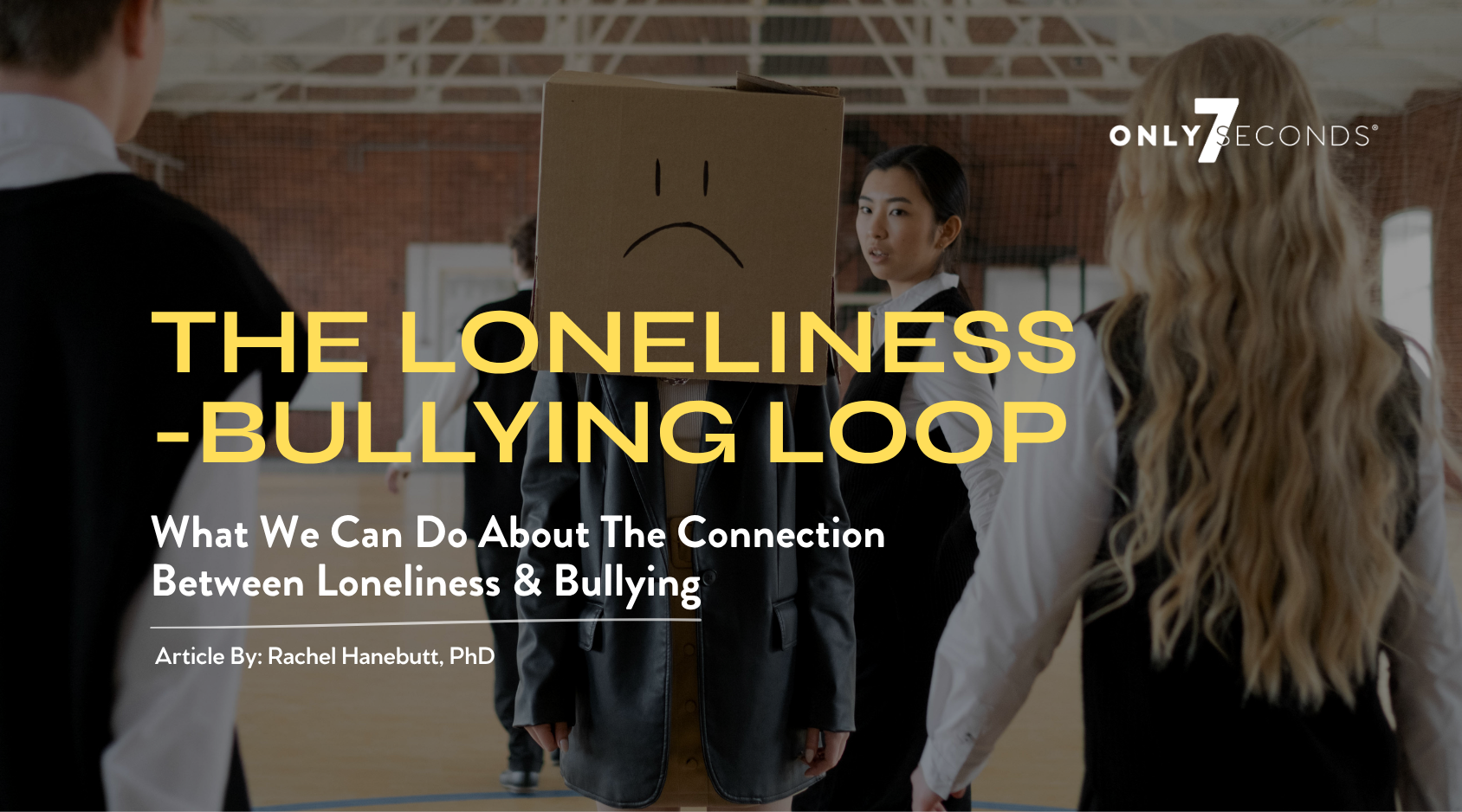 Title of The Loneliness-Bullying Loop, subtitle is What We Can Do About The Connection Between Loneliness & Bullying, photo depicts a young person with a brown cardboard box on their head with a sad frown face written on the box.